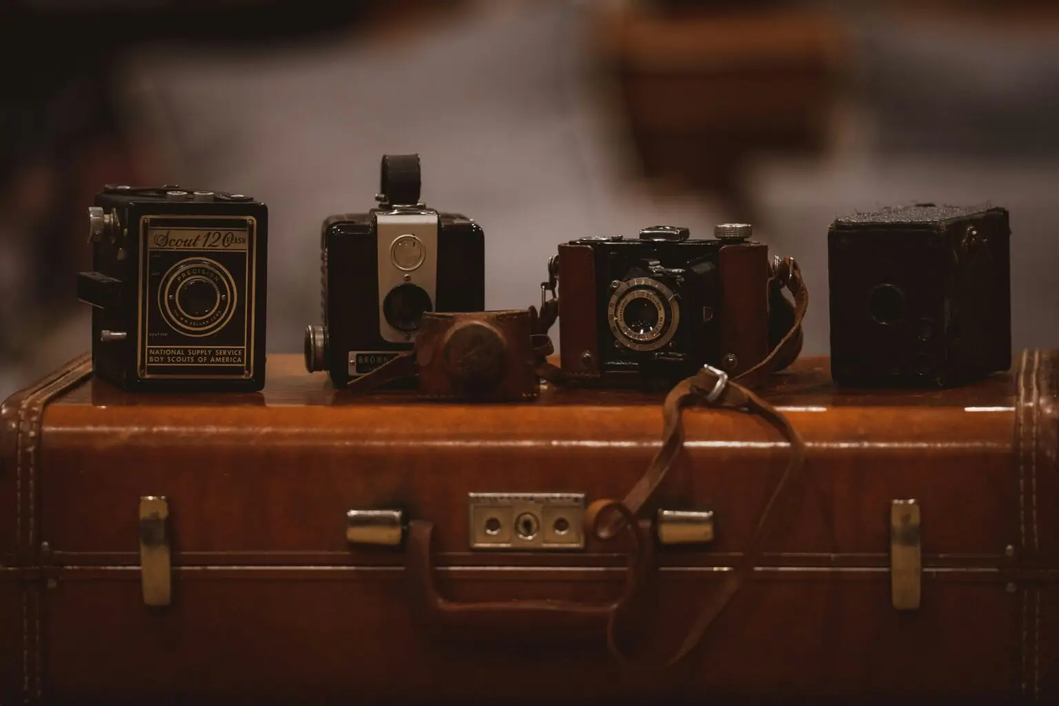 Cameras-on-brown-suitcase